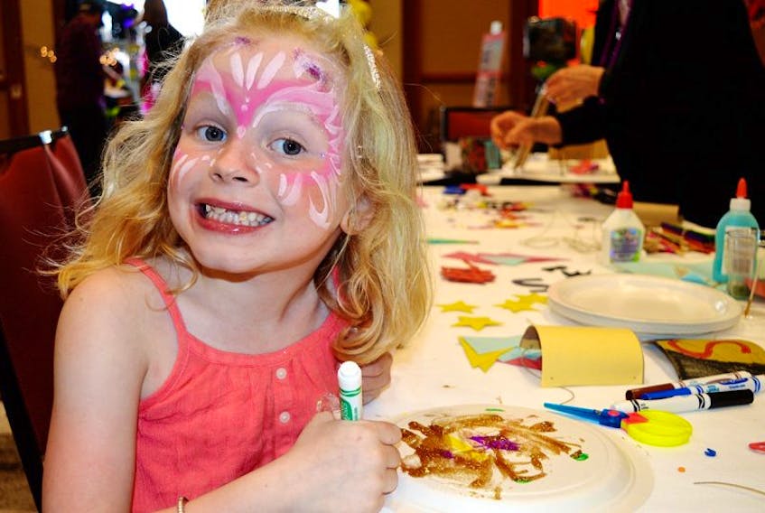 Blair Morris, 6, of Montague draws at the colouring station at the Princess and Superhero Party at the Delta Prince Edward Hotel in Charlottetown Sunday. The event was hosted by the Children’s Wish Foundation of Canada-Prince Edward Island Chapter to raise money so it can grant wishes to Island children diagnosed with a high-risk, life-threatening illness.