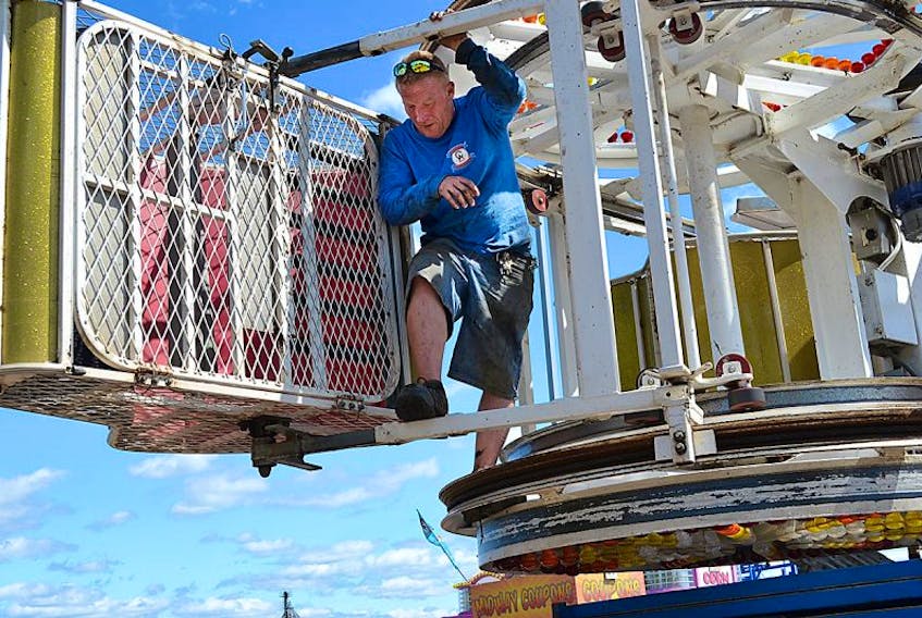 Campbell Amusements ride operator Mickey Legere was in Charlottetown Monday, inspecting one of the most popular rides that fair-goers enjoy during Old Home Week – the Zipper. Legere, who has been working at the job for 17 years, said the rides are checked each day to ensure everything is in working order for rider safety.