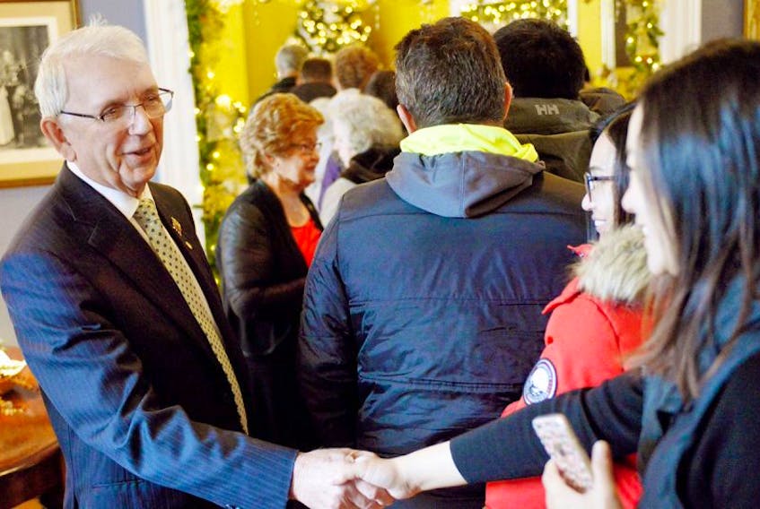 Lt.-Gov. Frank Lewis welcomes visitors during the Christmas open house at Fanningbank in Charlottetown
