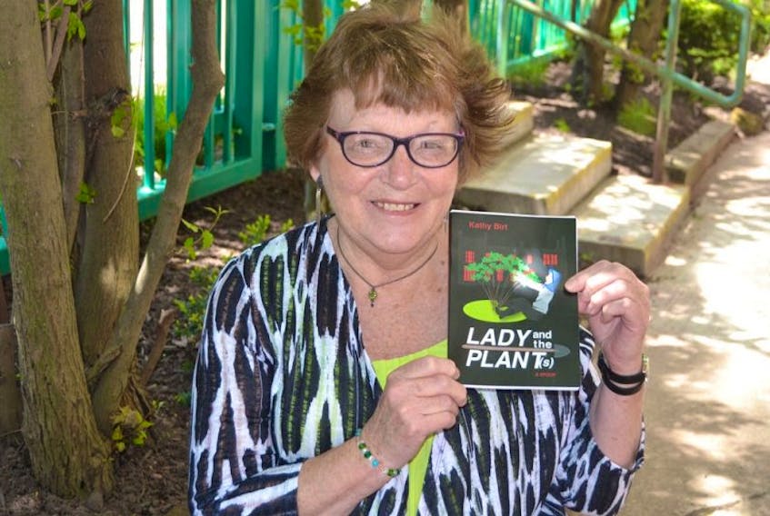 Kathy Birt holds a copy of her new book, "Lady and the Plant(s)”. The P.E.I. author will launch her crime novel spoof Saturday at 2 p.m. at the Haviland Club in Charlottetown.