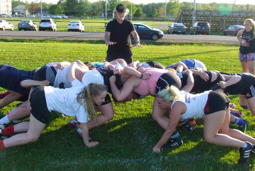 Co-coach Craig Inward instructs members of the new Charlottetown Rugby Football Club during a scrum at a recent practice. The club opens its inaugural season today with an exhibition match versus the Nova Scotia under-20 Keltics at 1 p.m. at Co-op Field in Charlottetown.