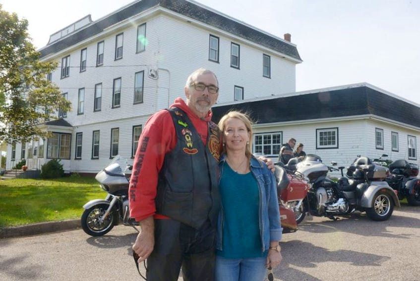 Dianne Young, chair of Lennon Recovery House Association, and Thanks for Giving motorcycle run organizer Donnie Aitken stand outside the recovery centre in South Rustico following the run on Saturday. About 150 motorcyclists helped raise more than $1,500 through the run.