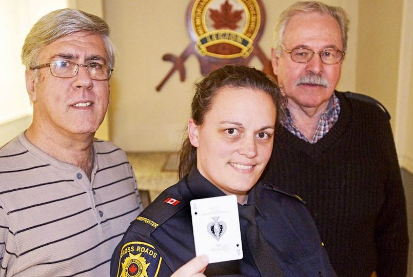Charlottetown Legion 2nd vice-president Kent MacDonald, from left, Crossroads Fire Department member Christa MacDonald and Legion president Jim Ross show the ace of spades used in the groupâs community draw. The group is hoping the ace will elude Islanders for a few months in order to grow the drawâs jackpot.