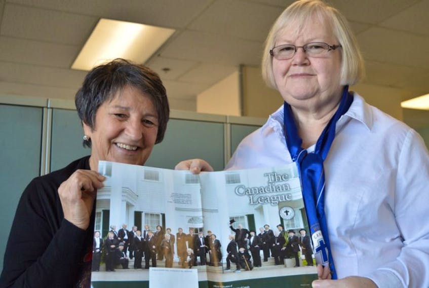 P.E.I. Catholic Women’s League (CWL) members Elaine Black, left, chairwoman of planning, and Irene Gallant, provincial president, display the cover of the league’s magazine, “The Canadian League”. It shows members of the CWL in P.E.I. recreating the famous Fathers of Confederation pose on the steps of Fanningbank in Charlottetown. With Canada’s 150th birthday in mind, the picture was done to promote the national convention in August in Charlottetown.