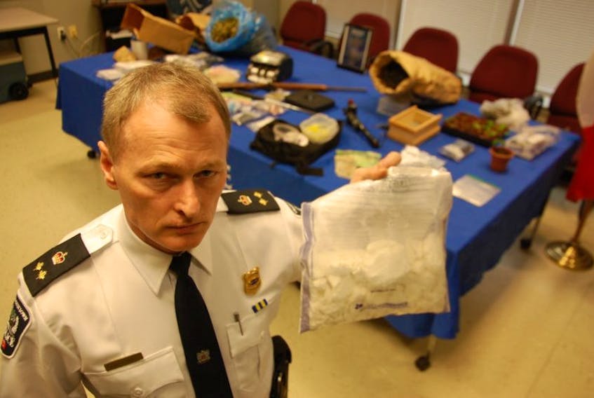 Charlottetown police Deputy Chief Brad MacConnell holds up a bag of cocaine from a seizure of more than $500,000 worth of the drug.