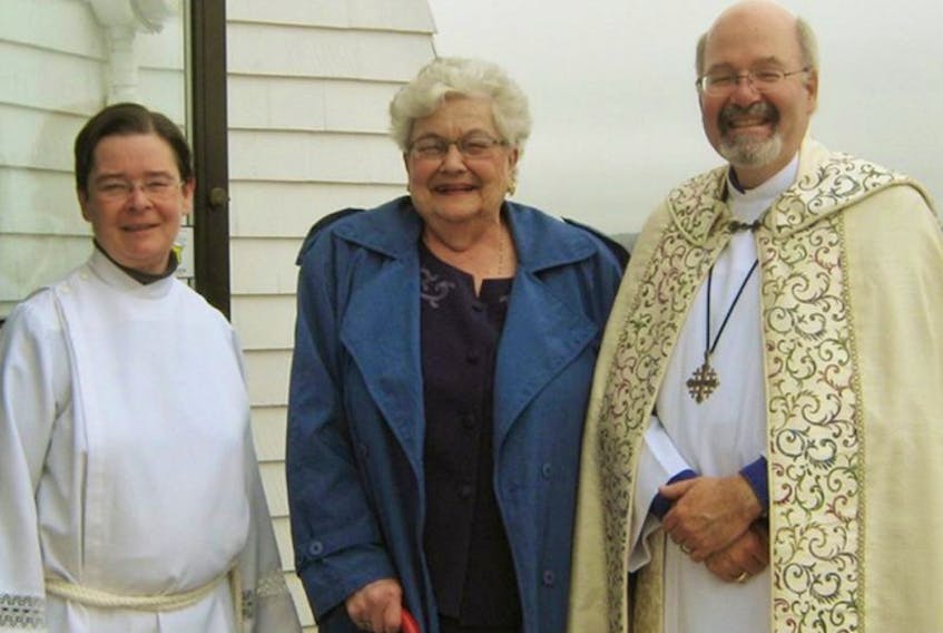 Rev. Margaret Collins, left, parish priest, Jean Profitt and Archbishop Rev. Ron Cutler, during the archbishop’s last visit to Crapaud.