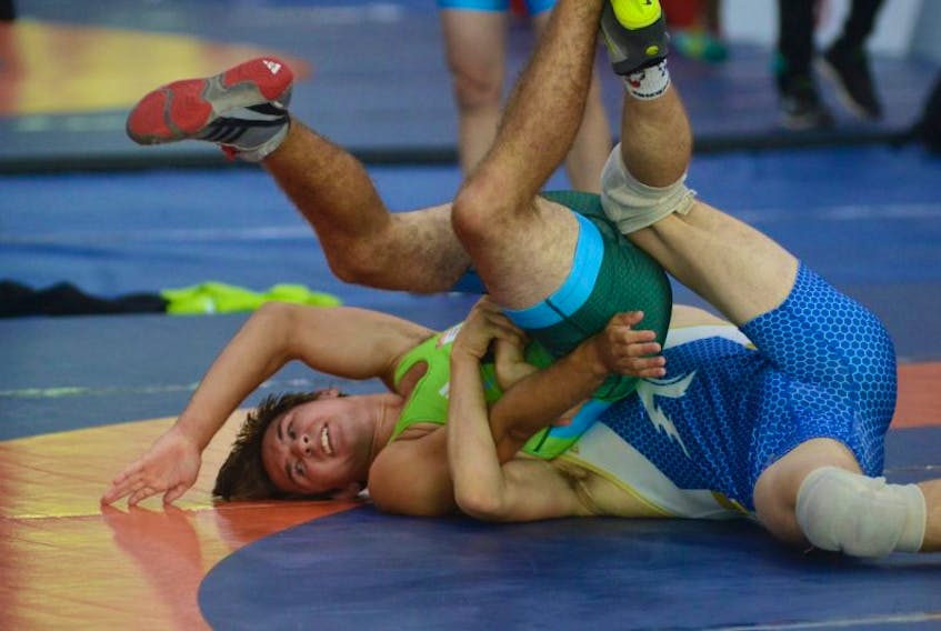 Stratford's Christian MacDonald, left, wrestled Alberta’s Connor McNeice Friday in semifinal action at the Canada Games in Winnipeg.