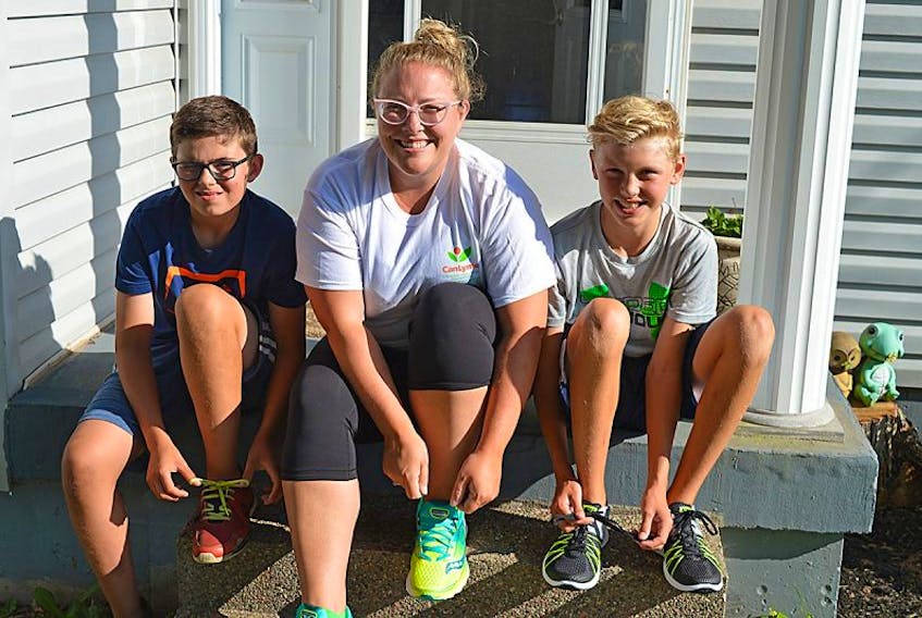 Fewer than two years ago, Stefanie Clark, centre, didn’t have enough strength to play with her children. Since then she has recovered from Lyme disease. Now, she’s lacing up her sneakers with her son, Ethan, right, and family friend Will Yeo to participate in a Lyme Disease Awareness 5K Run/Walk on Saturday at 9 a.m. It begins on the Confederation Trail between UPEI and the Farmers’ Market. Everyone is welcome.