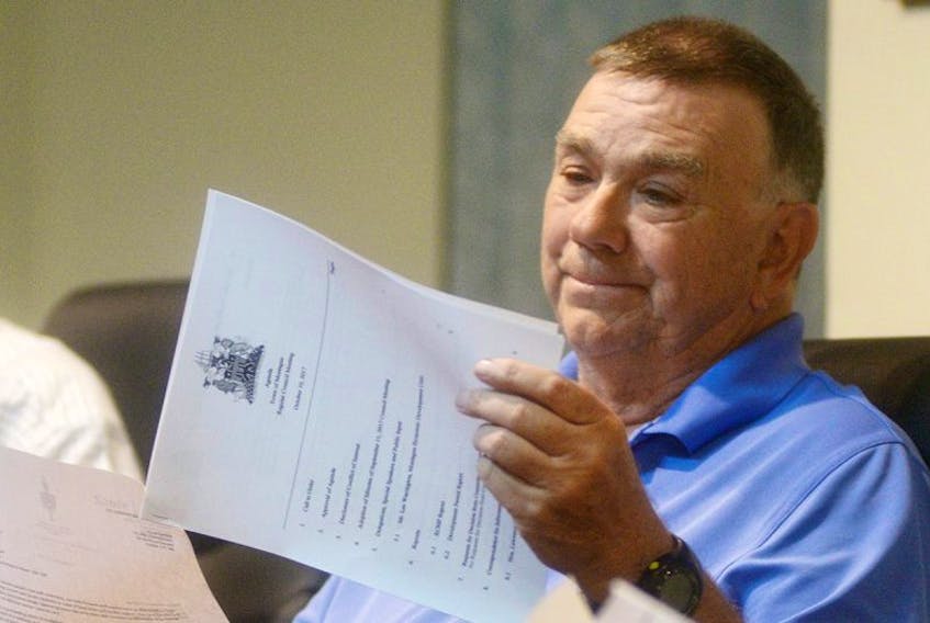 Montague Coun. Jim Bagnall looks through the agenda of Tuesday night’s regular council meeting. Bagnall has raised concerns over the Kings County Memorial Hospital’s emergency room following a closure last month.