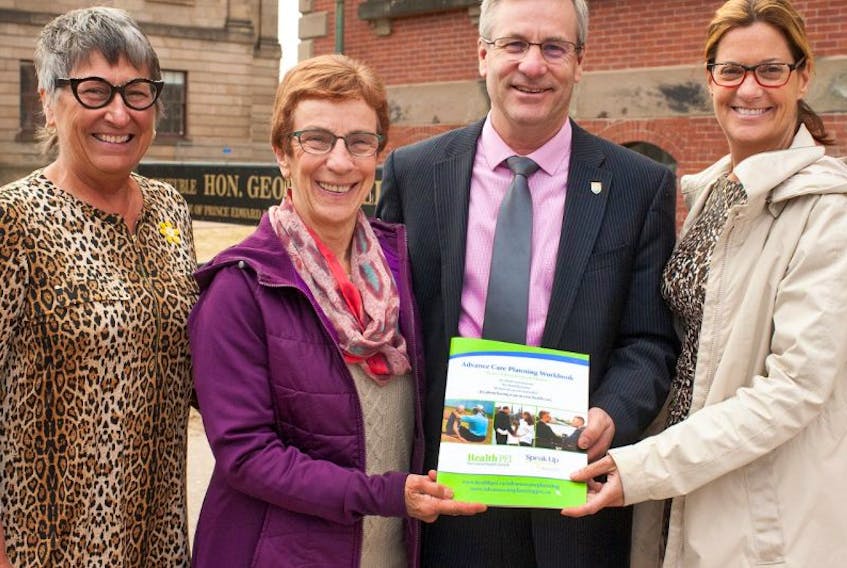 Health and Wellness Minister Robert Henderson launched a new advance care planning booklet and online tool to help Islanders discuss and plan for end-of-life care. Henderson was joined by, from left, advance care planning project coordinator Carolyn Villard, Hospice P.E.I. board member Linda Callard and provincial palliative care medical consultant Dr. Mireille Lecours. 