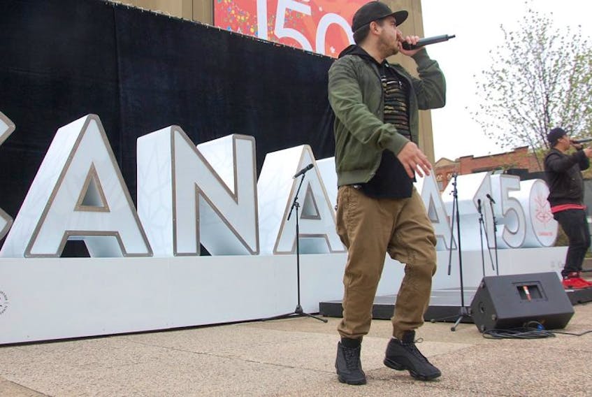 Members of City Natives, an award winning aboriginal hip-hop group originating from the Maritimes, performs Friday out in front of Confederation Centre of the Arts. The performance was part of entertainment provided at an announcement of funding for a series of community projects in P.E.I. to mark the Canada 150 anniversary year.
