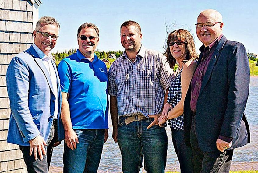 Economic Development and Tourism Minister Heath MacDonald, left; Dale Larkin, owner of Inn at the Pier; Matthew Jelley, chair of Resort Municipality of Stanley Bridge, Hope River, Bayview, Cavendish and North Rustico; Kim Champion, account manager at Eastlink; and Malpeque MP Wayne Easter attended an announcement Saturday of an Internet upgrade.