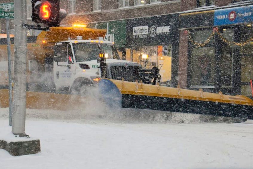 A snowplow clears Queen Street in Charlottetown Monday. By late afternoon, plows were out in full force across the province.