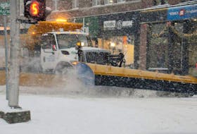 A snowplow clears Queen Street in Charlottetown.
