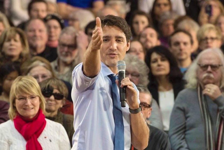 FILE PHOTO: Prime Minister Justin Trudeau gestures to a member of the audience during a town hall meeting in Peterborough, Ont. Friday January 13, 2017.