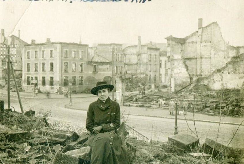 Chief Nurse Beatrice MacDonald is shown amid the rubble in France.