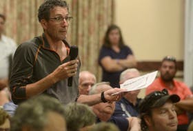 Tim Mair, a Georgetown resident who also owns property in the unincorporated area outside the town, asks a question during a meeting on the Three Rivers amalgamation last night. The meeting resulted in residents of the unincorporated areas of Georgetown Royalty and Burnt Point signing a petition to form a new resort municipality.