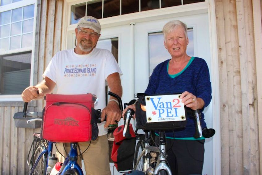 Dennis Duemeier, left, and Jane Henderson with their bikes outside their Summerside home. The husband and wife duo recently completed a 10-week cycling trip across most of Canada.