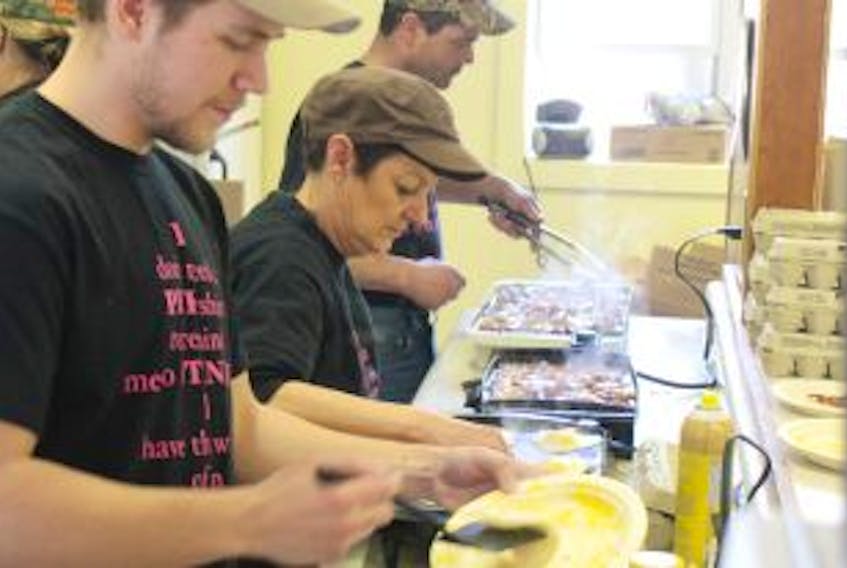 ['Colton Kennedy, from left, Zac Melanson, Holly MacKinnon and Duane Perry cook up batches of pancakes, bacon and eggs during the 3rd annual Matthew Murphy Memorial Fisherman’s Breakfast at Bonshaw Community Centre on Saturday.  Although the breakfast has been a tradition for more than 20 years, it was renamed in Murphy’s honour three years ago following the young fisherman’s death. Proceeds for the event go towards mental health services on P.E.I.']