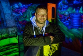 Maritime Fun Group president Matthew Jelley stands inside the Hanger Laser Tag Arena at the new Cavendish Beach Adventure Zone, which is set to open in the middle weekend of June. The room is fit with a number of black lights that bring out the neon wall graphics, which were all painted by hand with an airbrush, as well as the partitions. The colours were made using a specialized glow-in-the-dark powder that is mixed with latex paint.