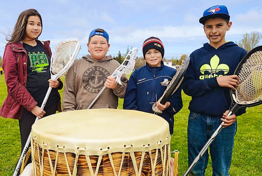 Members of P.E.I.’s team for this year’s North American Indigenous Games, from left, Nelly Jadis, Michael Jadis, Marcus Peter-Paul and Dylan Knockwood take part in the “Honouring the Creator’s Game” event held by Lacrosse P.E.I. in Morell on the weekend. The four will be a part of the 28 Islanders who will compete in the games, which are being held in Toronto this July.