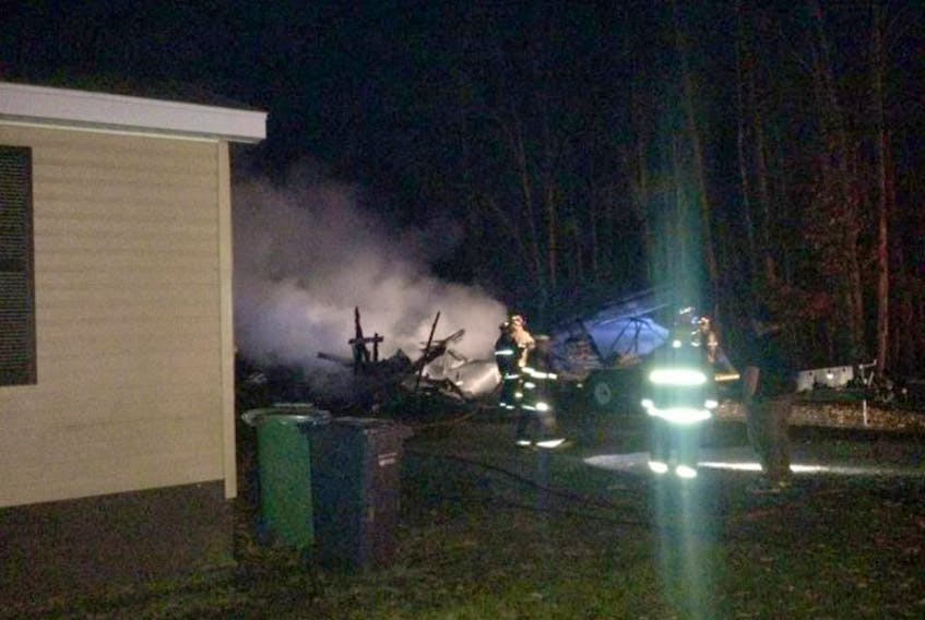 A fire in a garage was close to burning the adjacent home Monday, Nov. 14 but a quick response from neighbours and the fire department kept damage to a minimum.