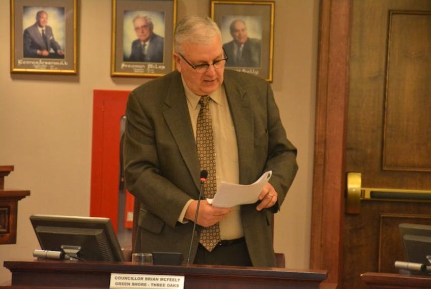 Coun. Brian McFeely, chairman of the Governance, Policy and Strategy Committee, reads the city’s new Cosmetic Pesticides and Integrated Pest Management Bylaw into the record during Monday night’s council meeting.