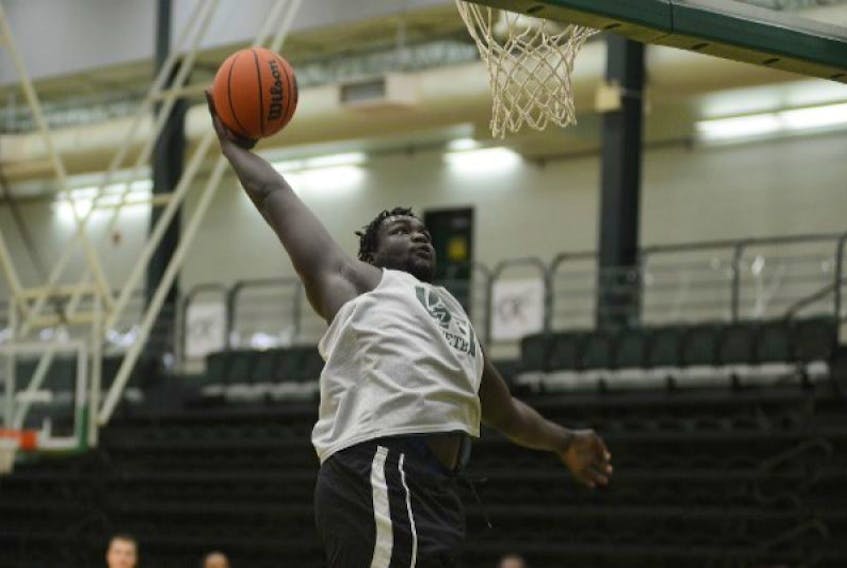 Dut Dut goes for a dunk during Thursday’s UPEI Panthers men’s basketball practice.