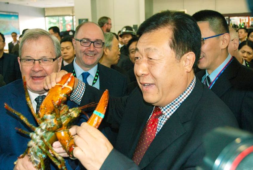 Federal Agriculture and Agri-Food minister Lawrence MacAulay is shown with the vice-minister of fisheries from China. MacAulay was at the China seafood expo promoting Atlantic Canadian lobster.