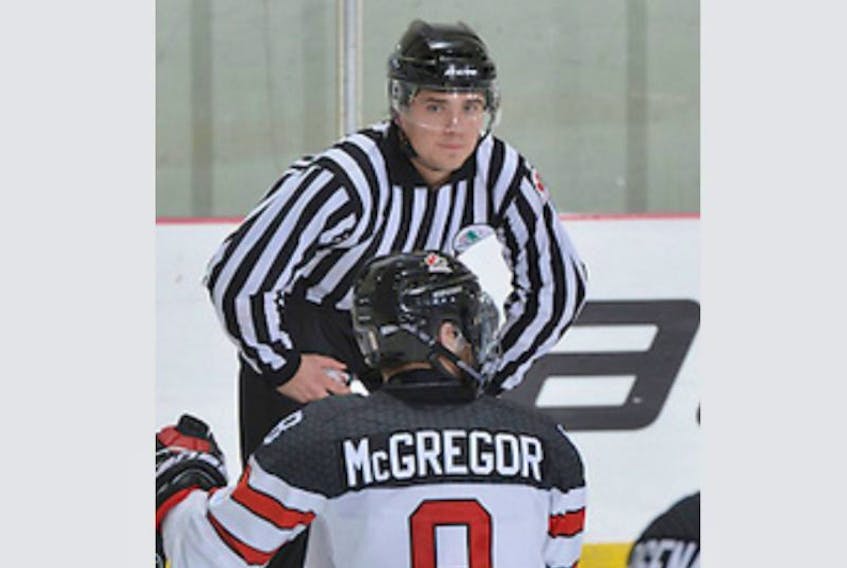 Morell native Jarrod MacAdam gets ready to drop the puck in a game between Canada and the United States at the world sledge hockey challenge last December in Charlottetown.