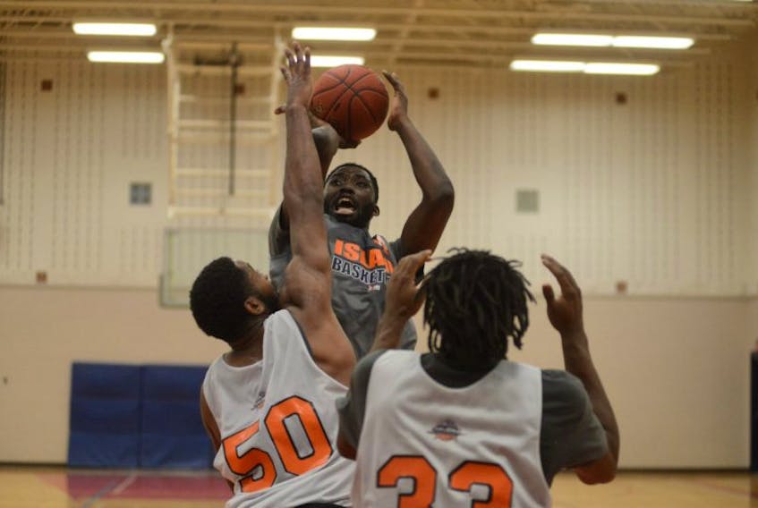 Dane Miller takes a contested shot over Dominique Dawson Saturday during the Island Storm's intrasquad game at Charlottetown Rural High School.