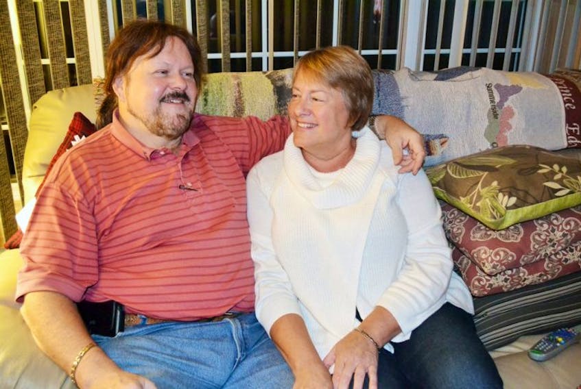Kent Ferguson and Laurie Ouellette relax at home in Burton where Ouellette continues to regain strength after going into cardiac arrest in Windsor, Ont., in July. They are thankful for the intervention of a nurse who was close by at the time.