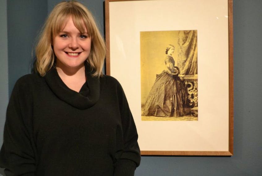 Gallery registrar Paige Matthie stands in front of a photograph of Caroline Louisa Daly, taken by Caldesi Blanford & Co., Photographers, London in 1860. Matthie’s research has confirmed Daley as the creator of art works previously attributed to men. “Introducing Caroline Louisa Daly”, an exhibition, is currently underway at the Confederation Centre Art Gallery.

