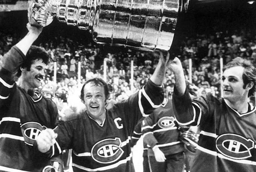 Yvon Lambert, from left, Yvan Cournoyer, and Guy Lafleur in a May 25, 1978 Stanley Cup celebration from the NHL archive.