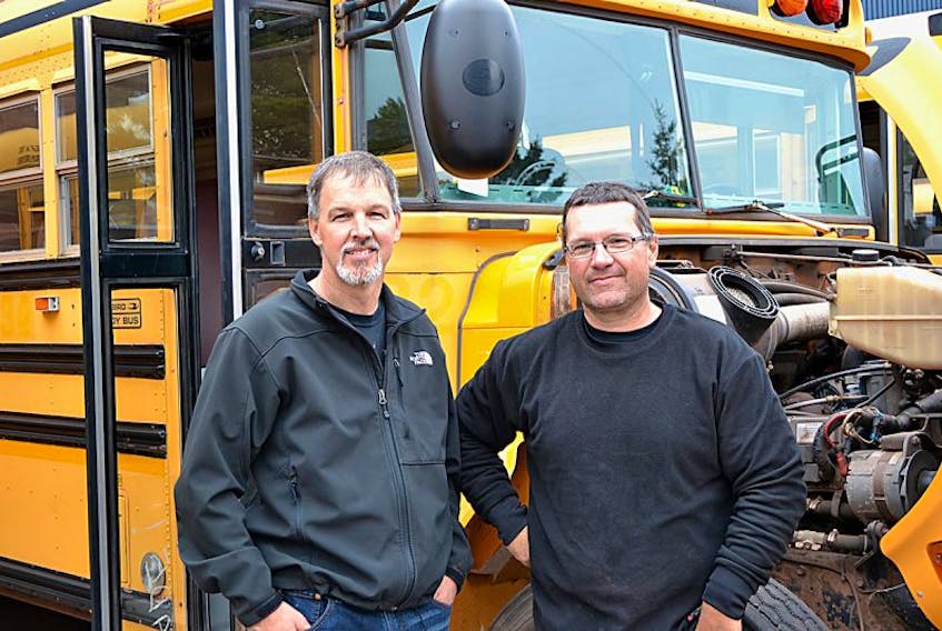 Kevin Doucette, left, and Holly Cahill of Tignish were in Charlottetown on Saturday to bid on a school bus at the provincial government’s annual public auction.
