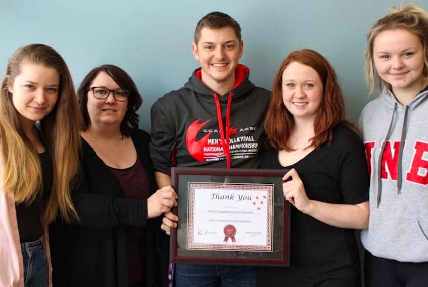 Business administration students Aysegul Tarhan, left, Tara McGuirk, Marcus Lapointe, Katlyn O’Brien and Megan Leblanc display the certificate of appreciation given them by Big Brothers Big Sisters for their participation in this year’s Bowl for Kids Sake. Holland College business administration students raised over $6,000, while staff and other students at the college brought the total to more than $8,200.