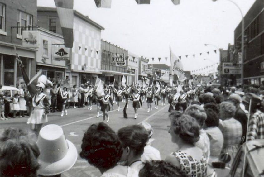 Majorettes march down Water Street in the Lobster Carnival Parade, circa 1960. Summerside seeks community help in making the Lobster Carnival Parade a success.
