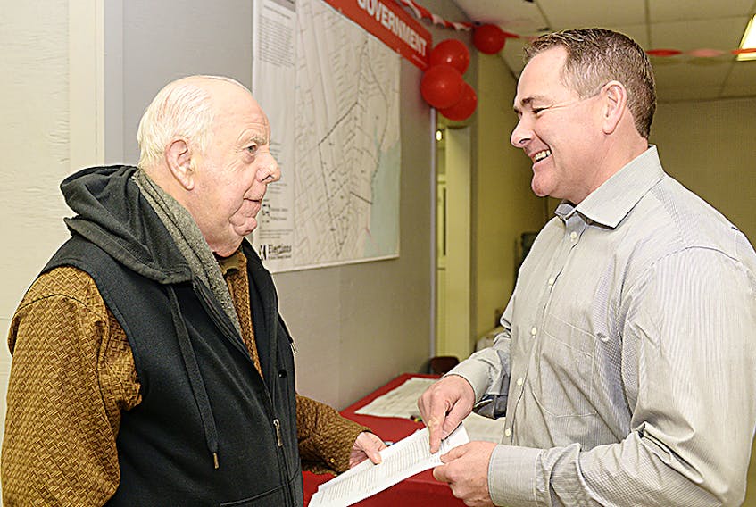 Liberal party candidate for the District 11 byelection Bob Doiron chats with supporter and father-in-law Leslie Rogerson at his campaign headquarters on Kensington Road in Charlottetown. ©THE GUARDIAN/Mitch MacDonald
