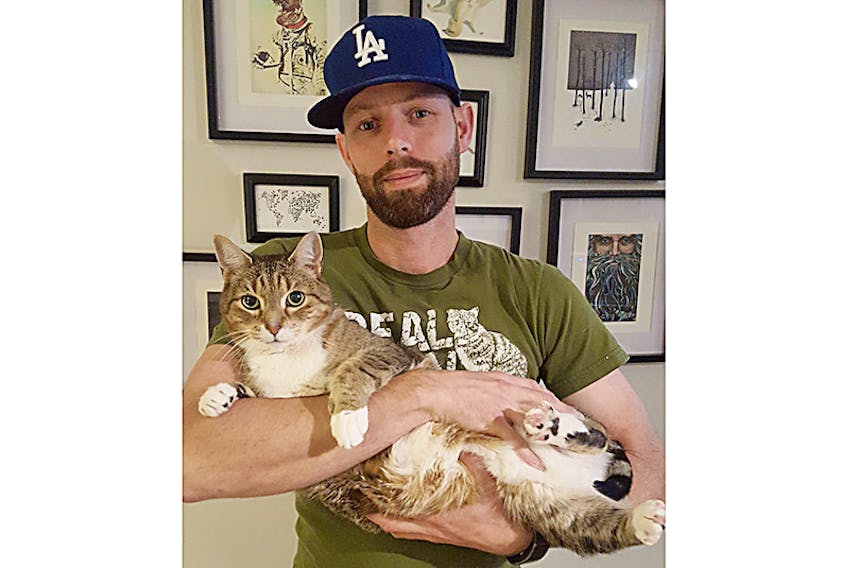 SpayAid P.E.I. president Michael Walsh, with his cat Gentleman Jim, is encouraging Islanders to donate to a GoFundMe campaign to help the volunteer charity reach a milestone of 3,000 spay/neuters in the province. ©THE GUARDIAN/Submitted photo