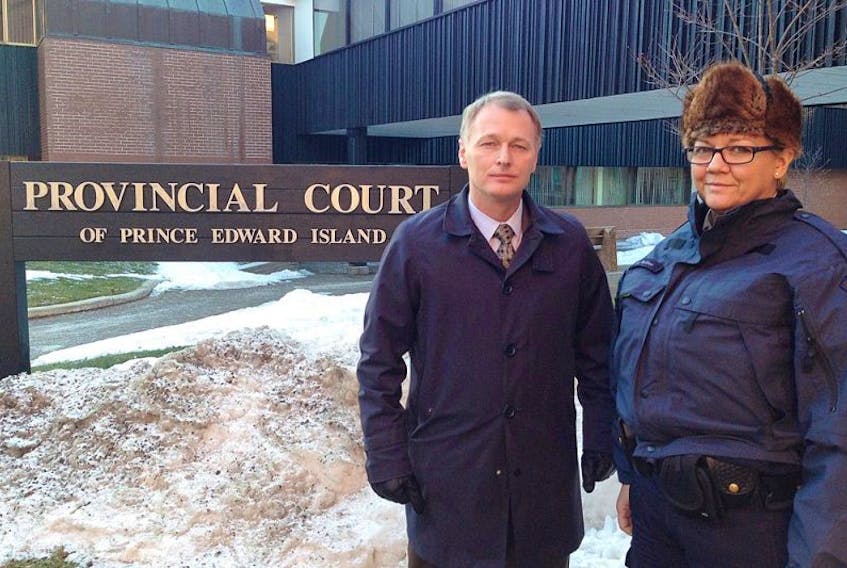 Charlottetown police Deputy Chief Brad MacConnell and RCMP Sgt. Leanne Butler stand outside the provincial courthouse Wednesday in Charlottetown after Richard Joseph Arsenault was sentenced to nine years in prison.