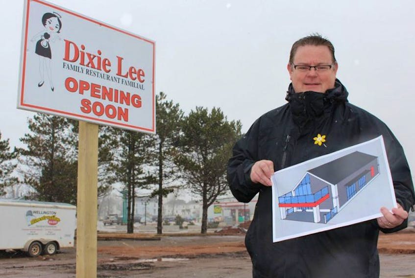 Major Stewart with the exterior design of Summerside’s Dixie Lee location, which is set to open in June.