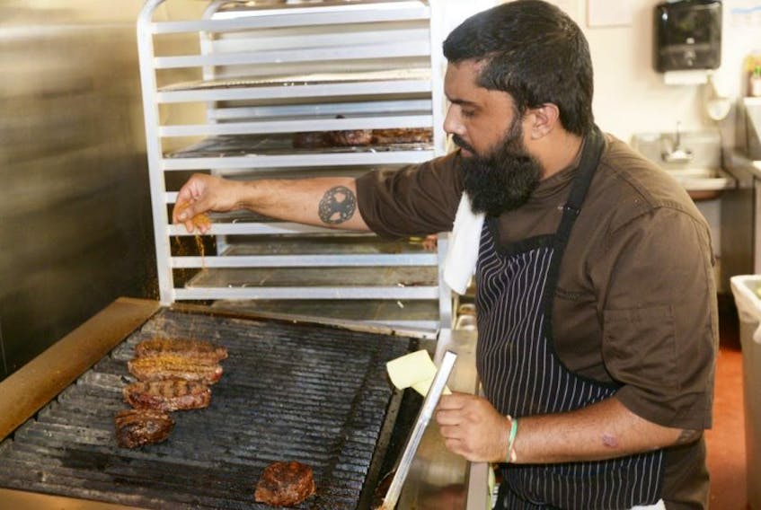 Shakel Akhtar, sous-chef, mans the grill at The Barrington Steakhouse and Oyster Bar in Halifax. Akhtar brings plenty of experience to the location after having previously worked at the Murphy Hospitality Group’s Sims Corner Steakhouse and Oyster Bar in Charlottetown.