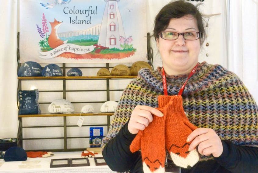 Newcomer Tatiana Mizerina holds up two of her P.E.I. fox mittens, which won Best New Product of 2017 in the P.E.I. Craft Council’s Buyers’ Market at the Delta Prince Edward last weekend. The mittens were a hot seller around Christmas time and are made with 100 per cent wool from MacAusland Woolen Mills in Bloomfield.