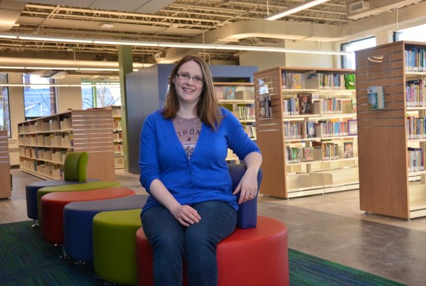 Rebecca Boulter, literacy and public services librarian at the Summerside Inspire Learning Centre, sits in the library's new facility.