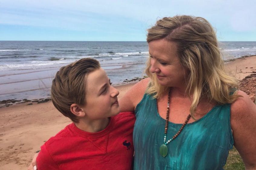 Beth Johnston and her son, Charlie Ross, are shown on the beach in Savage Harbour Monday where they had the fright of their lives Saturday evening after getting caught in a rip current.