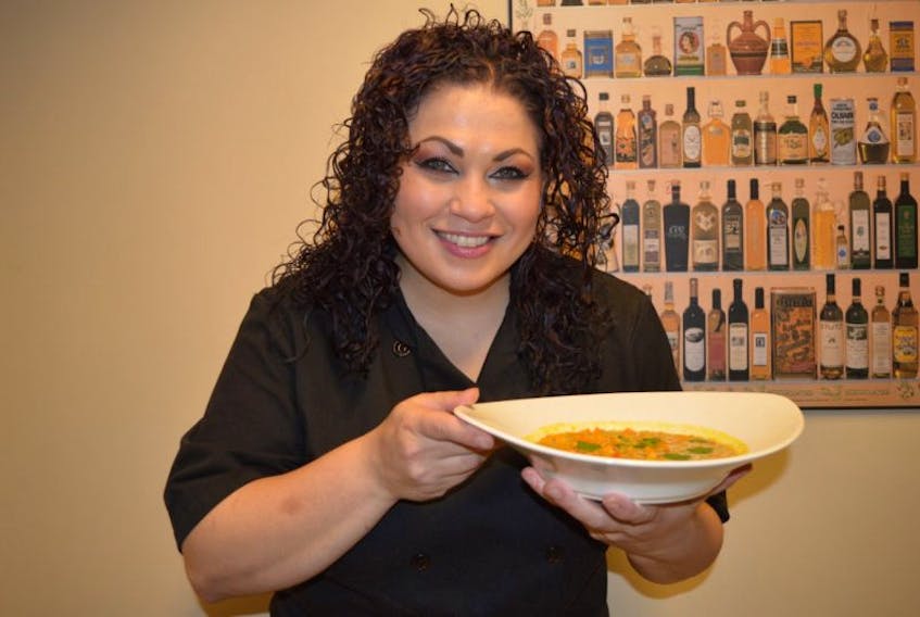 Chef Ilona Daniel gets ready to serve a bowl of Curried Quinoa Soup.