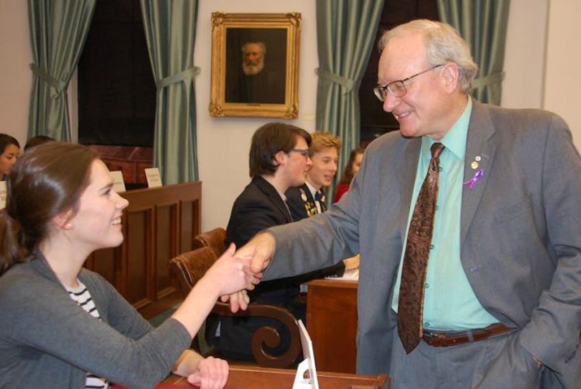 Premier Wade MacLauchlan welcomes Harley Brennan to the Legislative Assembly Friday shortly before the start of Youth Parliament. Brennan, sitting as the MLA for Evangeline-Miscouche, was among students from numerous P.E.I. high schools acting in the role of Island legislators this week.