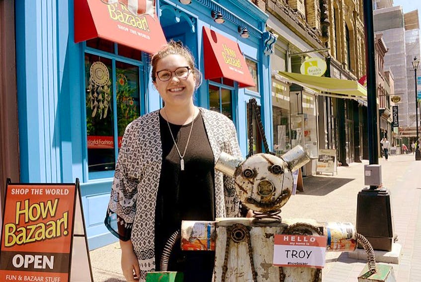 How Bazaar Halifax manager Avery Hillstrom stands outside the new Barrington Street location with the store’s mascot “Troy.” Hillstrom said the store has seen lots of traffic since opening earlier this spring.