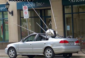 Hamilton artist Brandon Vickerd has created “Sputnik Returned 2” a replica of Sputnik, the first man made satellite to orbit the earth. It’s installed as if it has crash-landed into a parked sedan.