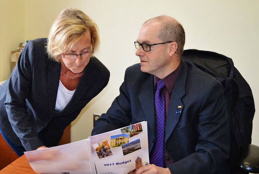 Coun. Melissa Hilton, chairwoman of the finance committee, goes over the budget one last time with Scott Ryan, manager of finance on Tuesday. The City of Charlottetown makes its budget public at noon on Wednesday.